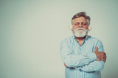 Full length of man standing against white background