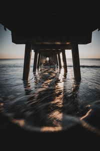 Pier on sea against sky