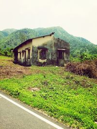 Built structure with green plants in foreground