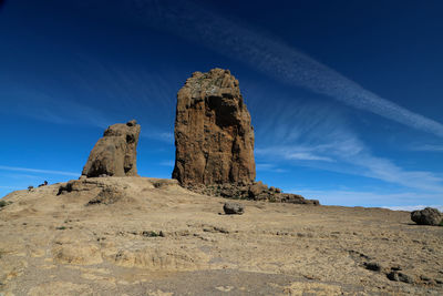 Low angle view of rock formations against sky