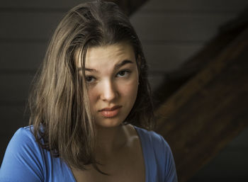 Portrait of girl making irritating face with raised eyebrow