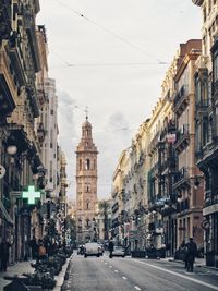 City street amidst buildings against sky