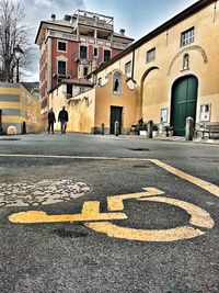 Road signs in city against sky