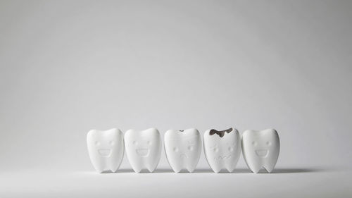 Close-up of objects on table against white background