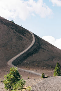 Scenic view of mountain road against sky