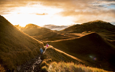 High angle view of hikers walking on landscape