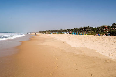 Scenic view of beach against clear sky