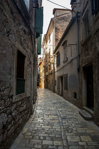 Narrow alley along old buildings