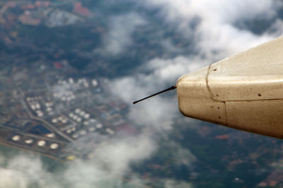 High angle view of communications tower against cloudy sky