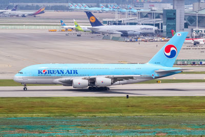 View of airplane at airport runway