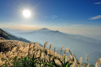 Scenic view of mountains against sky at sunset