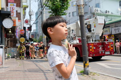 Boy on street in city