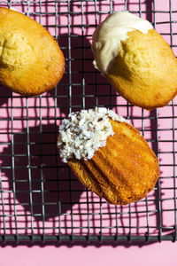 High angle view of madeleines against pink background