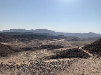 Scenic view of desert against clear sky