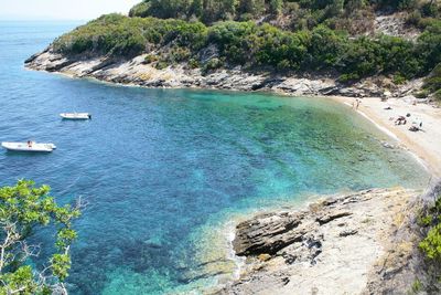 High angle view of sailboats on sea shore