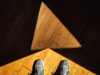 Low section of man standing on floor