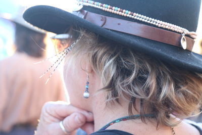 Close-up portrait of woman wearing hat