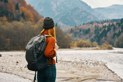 Rear view of man looking at mountains