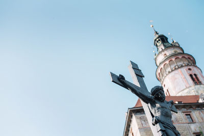 Low angle view of church and building against clear sky