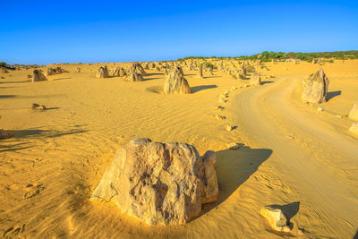 Panoramic view of desert against clear sky