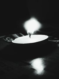 Low angle view of illuminated lamp at night