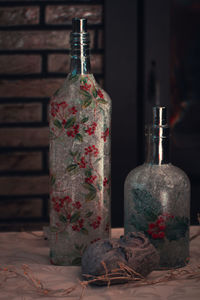 Close-up of wine bottles on table