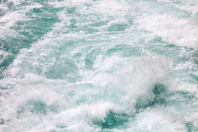 High angle view of waves splashing in sea