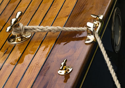 Close-up of ropes on wood