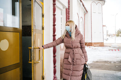 Masked girl at the train station