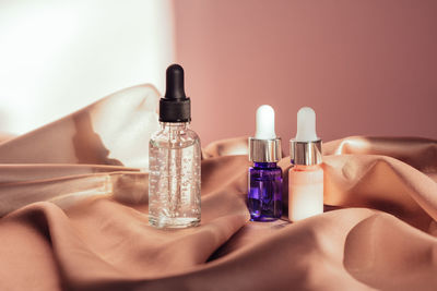 Set of glass bottles with liquid with bubbles.serum or essential aroma oil, aromatherapy and massage