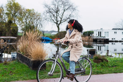 Rear view of woman riding bicycle