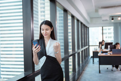 Young woman using smart phone