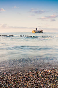 Scenic view of sea against sky during sunset
