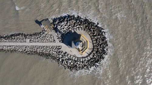 High angle view of umbrella by sea