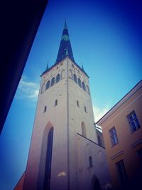 Low angle view of church against blue sky