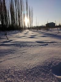 Surface level of frozen road against sky