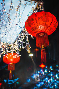 Low angle view of illuminated lanterns hanging on tree