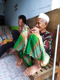 Grandpa grandpa sitting telling stories while waiting for iftar