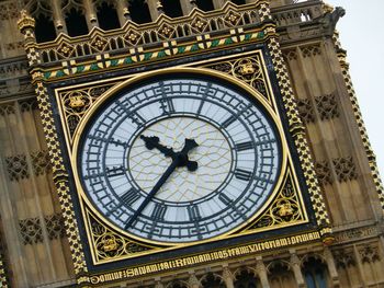 Close-up of clock on tower