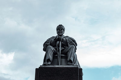 Low angle view of statue against sky