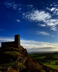 Scenic view of landscape against cloudy sky