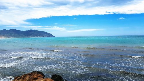 Scenic view of sea against blue sky