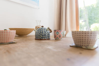 Close-up of wicker basket on table at home