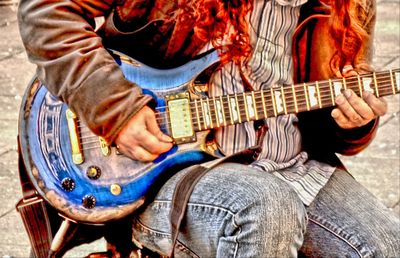 Close-up of guitar in the dark