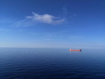 Scenic view of sea against blue sky