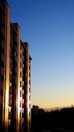 Low angle view of buildings against clear sky