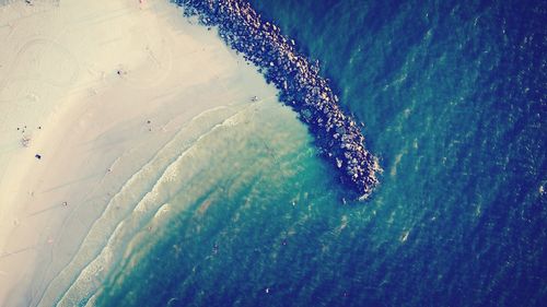 Aerial view of groyne in sea