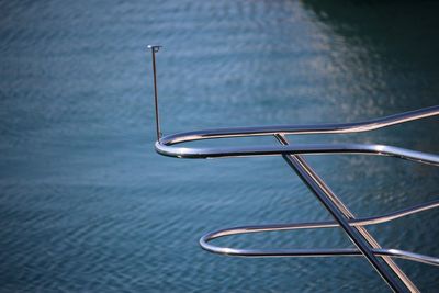 Close-up of boat railing on sea