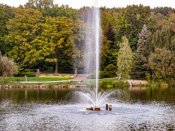 Scenic view of fountain in lake