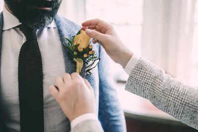 Close-up of man holding hands